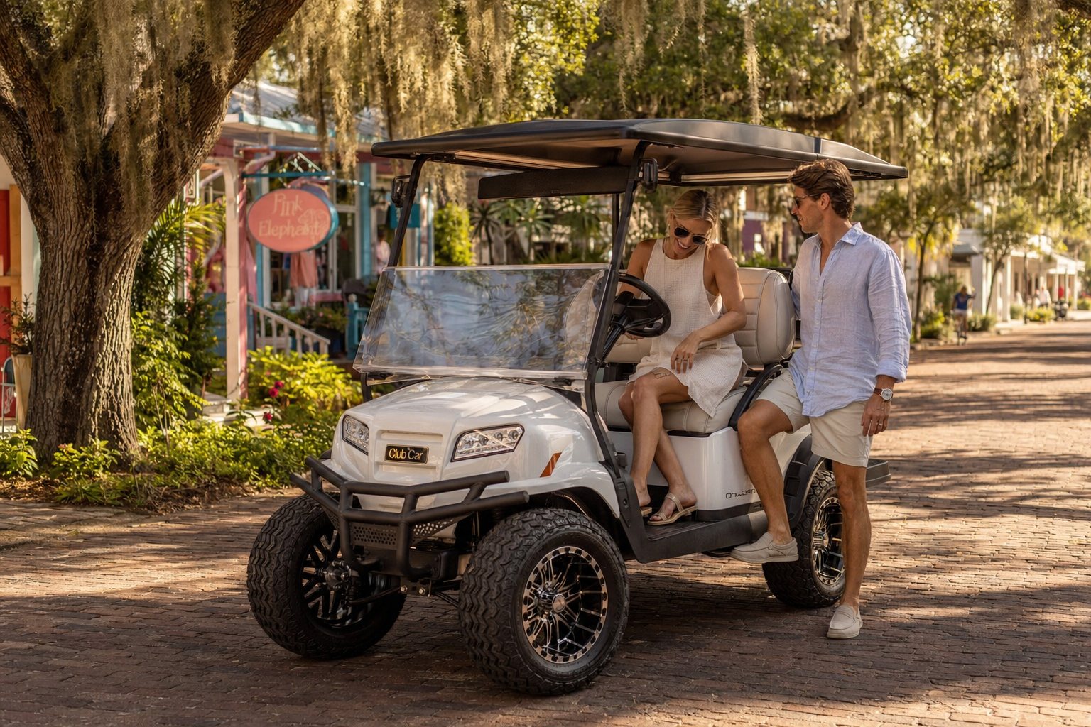 White lifted golf cart parked on a historic Boca Grande street